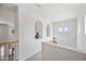 Second-floor hallway featuring recessed alcoves and views of the surrounding neighborhood at 19242 W Pasadena Ave, Litchfield Park, AZ 85340