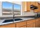 This kitchen includes granite counters, wooden cabinetry and stainless appliances at 19242 W Pasadena Ave, Litchfield Park, AZ 85340