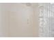 Clean shower space features a shower head and niche, accented by a glass block wall at 19242 W Pasadena Ave, Litchfield Park, AZ 85340