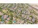 Scenic aerial view of a Gathering-oriented community with lush green spaces, swimming pools and easy highway access at 20412 W Thayer St, Buckeye, AZ 85396