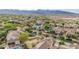 Expansive aerial view of a meticulously planned community, showcasing homes with well-maintained landscaping and mountain views at 20412 W Thayer St, Buckeye, AZ 85396