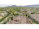 An aerial photo of a community with tidy landscaping, houses, park, and a mountain view in the background at 20412 W Thayer St, Buckeye, AZ 85396