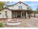 Elegant backyard with a covered patio, outdoor fire pit, and dining area at 20412 W Thayer St, Buckeye, AZ 85396