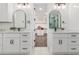 Modern bathroom featuring double vanities, stone countertops, and a view into the closet at 20412 W Thayer St, Buckeye, AZ 85396