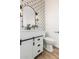 Contemporary bathroom with stylish vanity and floral pattern backsplash at 20412 W Thayer St, Buckeye, AZ 85396