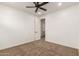 A clean bedroom with carpet and ceiling fan at 20412 W Thayer St, Buckeye, AZ 85396