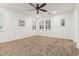Spacious bedroom with recessed lighting, ceiling fan, and large window at 20412 W Thayer St, Buckeye, AZ 85396