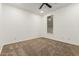 A bedroom featuring carpeted floors, white walls, a window, and a ceiling fan at 20412 W Thayer St, Buckeye, AZ 85396
