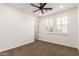 A clean bedroom with carpet, white shutters, and ceiling fan at 20412 W Thayer St, Buckeye, AZ 85396