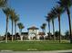 Inviting community park entrance framed by stately palm trees and manicured lawns, perfect for Gathering outings and relaxation at 20412 W Thayer St, Buckeye, AZ 85396