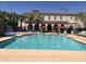 Resort-style pool with splash pad, lounge chairs, and shaded seating area for Gathering enjoyment at 20412 W Thayer St, Buckeye, AZ 85396
