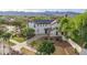Inviting two-story home featuring solar panels, a covered porch, and a well-manicured front yard with mountain views at 20412 W Thayer St, Buckeye, AZ 85396