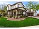 Charming two-story home featuring a welcoming front porch and a beautifully landscaped yard at 20412 W Thayer St, Buckeye, AZ 85396
