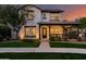 Charming two-story home with covered front porch and manicured lawn at 20412 W Thayer St, Buckeye, AZ 85396