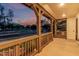 Charming covered front porch with wood posts and railings, offering a relaxing outdoor space at 20412 W Thayer St, Buckeye, AZ 85396
