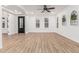 Expansive living room with wood flooring and recessed lighting throughout at 20412 W Thayer St, Buckeye, AZ 85396