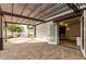Inviting outdoor patio area with pergola covering and open access to the home's interior at 20412 W Thayer St, Buckeye, AZ 85396