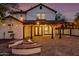 Covered patio with fire pit and built-in seating is perfect for outdoor gatherings at 20412 W Thayer St, Buckeye, AZ 85396