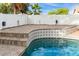 Pool detail with beautiful tiling, accentuating the clean water and well-maintained space in a backyard at 20412 W Thayer St, Buckeye, AZ 85396
