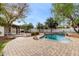 Inviting backyard oasis with a sparkling pool and charming patio area, perfect for relaxation and entertaining at 20412 W Thayer St, Buckeye, AZ 85396