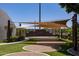 Outdoor amphitheater with artificial turf and shade structures at 2309 W Naranja Ave, Mesa, AZ 85202