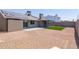 Spacious backyard with pavers, gravel, artificial turf and a covered patio at 2309 W Naranja Ave, Mesa, AZ 85202