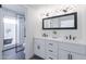 Modern bathroom featuring double vanity and glass enclosed shower at 2309 W Naranja Ave, Mesa, AZ 85202