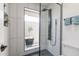 Glass enclosed shower with black shower head and black fixtures at 2309 W Naranja Ave, Mesa, AZ 85202