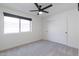 Bedroom with a view from the window and neutral colored carpet flooring at 2309 W Naranja Ave, Mesa, AZ 85202