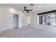 Bright bedroom with carpet, ceiling fan, closet, and window providing lots of light at 2309 W Naranja Ave, Mesa, AZ 85202