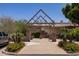 View of community center entrance featuring desert landscaping and flower beds at 2309 W Naranja Ave, Mesa, AZ 85202