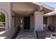 Inviting home entrance with a decorative gate and potted plants at 2309 W Naranja Ave, Mesa, AZ 85202
