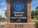 Dobson Ranch Golf Course sign at entrance with well-maintained landscaping and clear visibility at 2309 W Naranja Ave, Mesa, AZ 85202