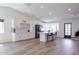 Bright kitchen with white cabinets, a large island, and stainless steel appliances at 2309 W Naranja Ave, Mesa, AZ 85202