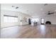 Spacious living room featuring an open floor plan and modern lighting fixtures at 2309 W Naranja Ave, Mesa, AZ 85202