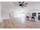 Spacious living area featuring hardwood floors, modern fixtures, and an open layout at 2309 W Naranja Ave, Mesa, AZ 85202