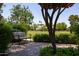 Serene park setting with a bench overlooking a spacious lawn and mature trees at 2309 W Naranja Ave, Mesa, AZ 85202