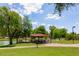 Scenic picnic area by the water with shaded pavilion and barbecue grill at 2309 W Naranja Ave, Mesa, AZ 85202
