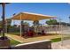 Community playground with shade structure and soft surface at 2309 W Naranja Ave, Mesa, AZ 85202