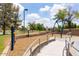 Safe, accessible playground with adaptive equipment and smooth pathways at 2309 W Naranja Ave, Mesa, AZ 85202