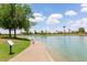 Picturesque pond with walking path and wildlife within a well-kept park at 2309 W Naranja Ave, Mesa, AZ 85202