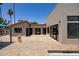 Community pool house and bath houses with neutral paint and tile detail, and desert landscaping at 2309 W Naranja Ave, Mesa, AZ 85202