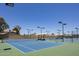Outdoor tennis courts with shade structures on a sunny day at 2309 W Naranja Ave, Mesa, AZ 85202