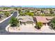 Beautiful aerial view of a well-maintained property with a lush landscaped yard and tile roof in a quiet neighborhood at 2405 W Memorial Dr, Anthem, AZ 85086