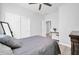 Comfortable bedroom with soft grey walls, wood-style floors, and ceiling fan at 2405 W Memorial Dr, Anthem, AZ 85086
