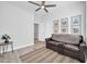 Well-lit bedroom with a contemporary design, ceiling fan, and cozy furnishings at 2405 W Memorial Dr, Anthem, AZ 85086