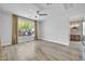 Spacious bedroom boasts light wood floors, neutral walls, and a sunny window view at 2405 W Memorial Dr, Anthem, AZ 85086