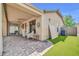 Covered patio with brick pavers and seating, plus an artificial grass area on the side at 2405 W Memorial Dr, Anthem, AZ 85086