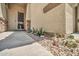 Inviting covered front porch with desert landscaping and a decorative security door at 2405 W Memorial Dr, Anthem, AZ 85086