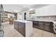 Modern kitchen features a central island, white cabinetry, and stainless steel appliances at 2405 W Memorial Dr, Anthem, AZ 85086